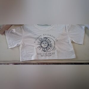 White Graphic Tee with Sun and Moon Design